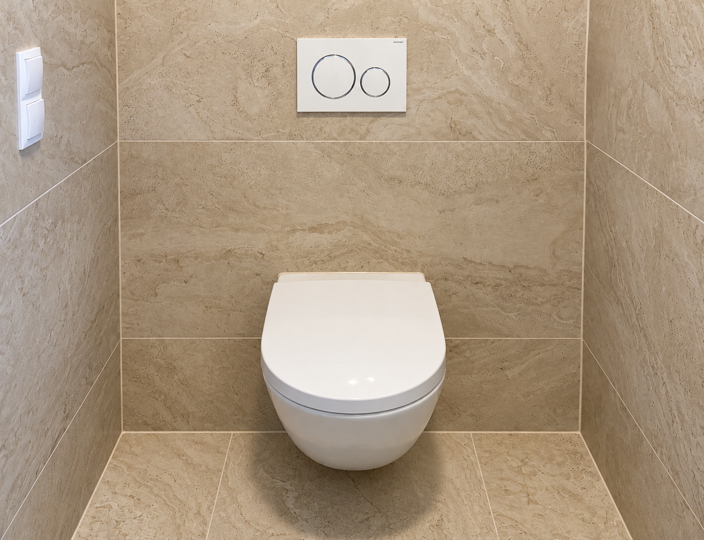Clean beige tiled wall-hung WC
