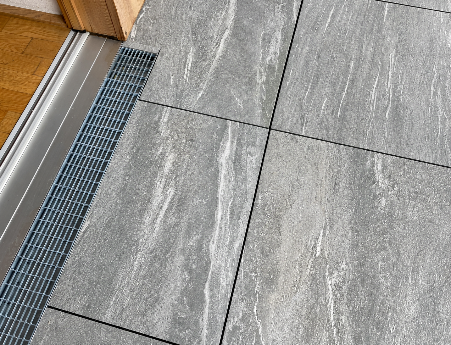 Grey Stone Slabs and Drainage Grate