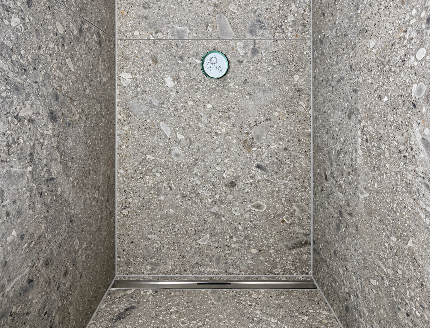 Grey terrazzo shower with linear drain