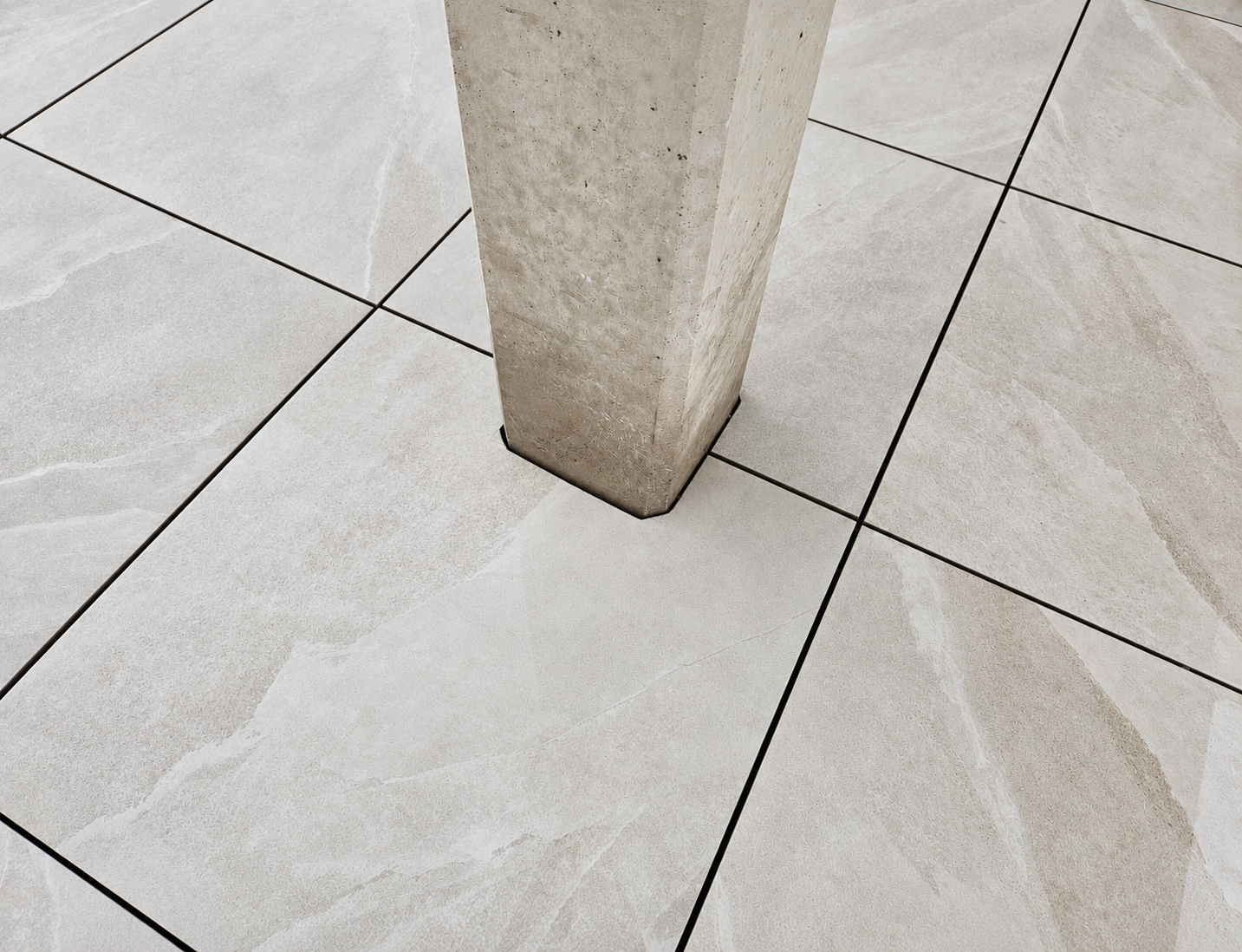 Mottled tiles around a concrete post