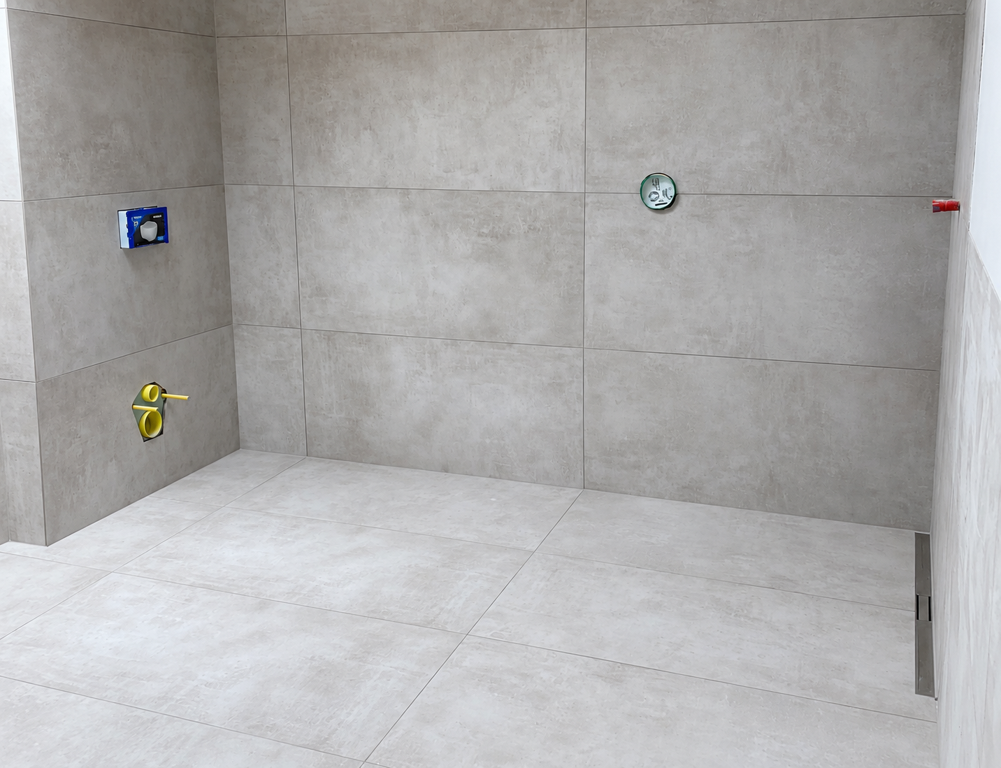 Newly tiled grey bathroom in progress