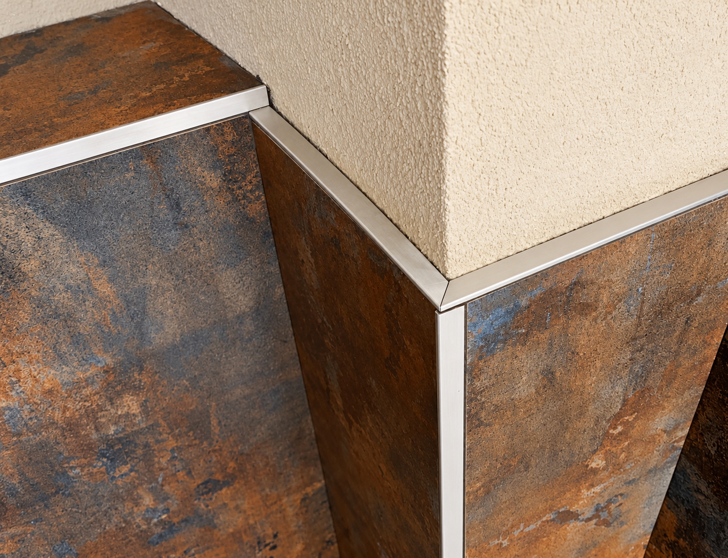 Patterned tiles with mitred silver trim