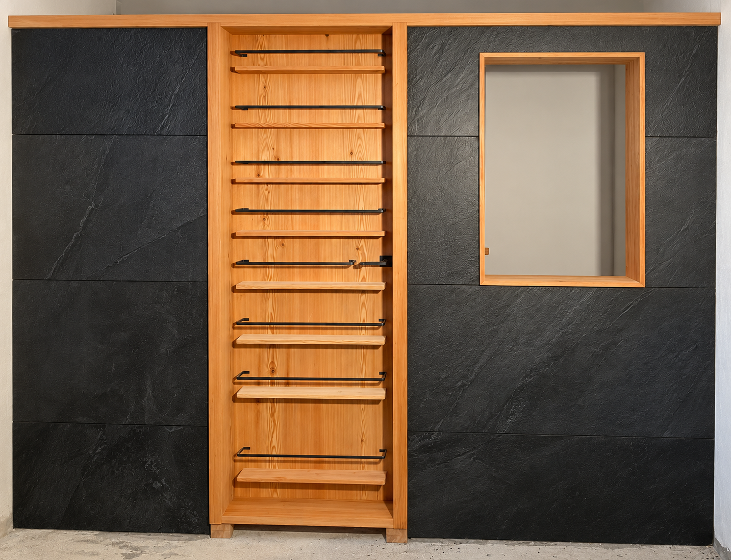 Slate feature wall, timber rack, framed mirror