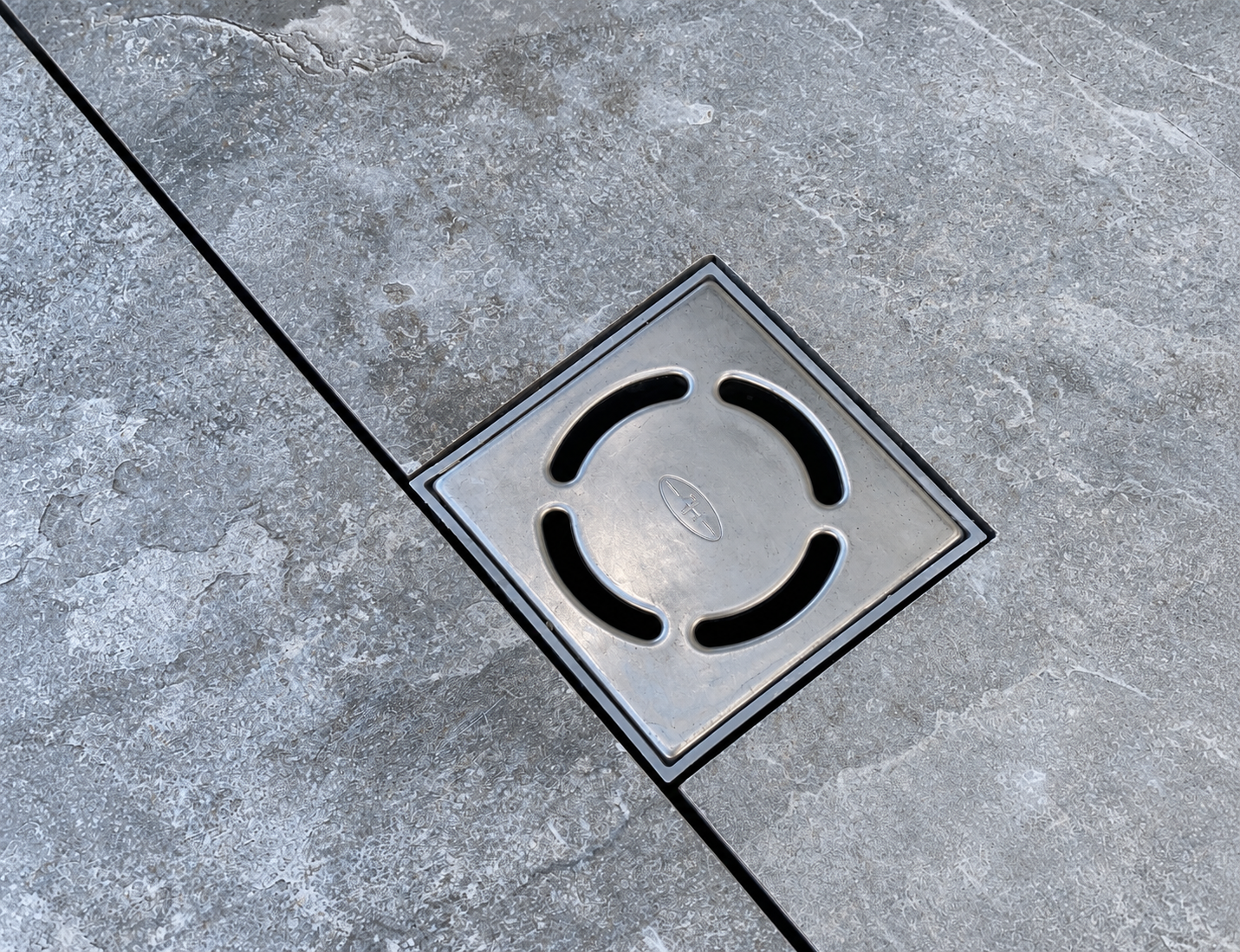 Stone Tile and Square Drain