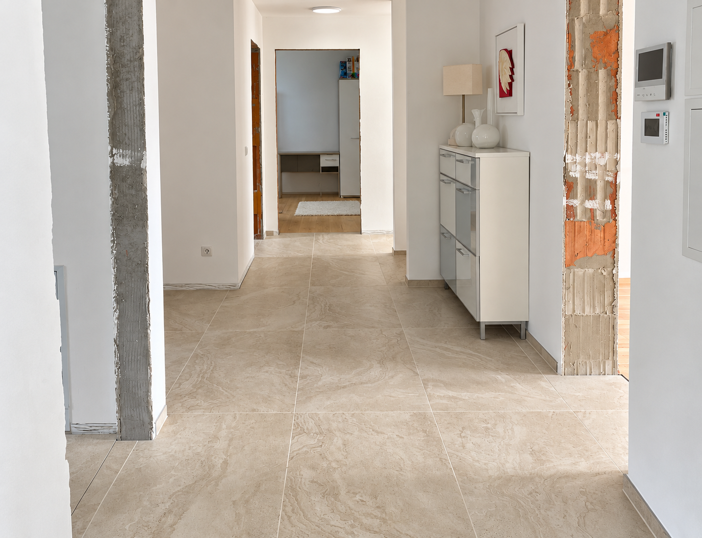 Warm daylight on authentic beige hallway tiles